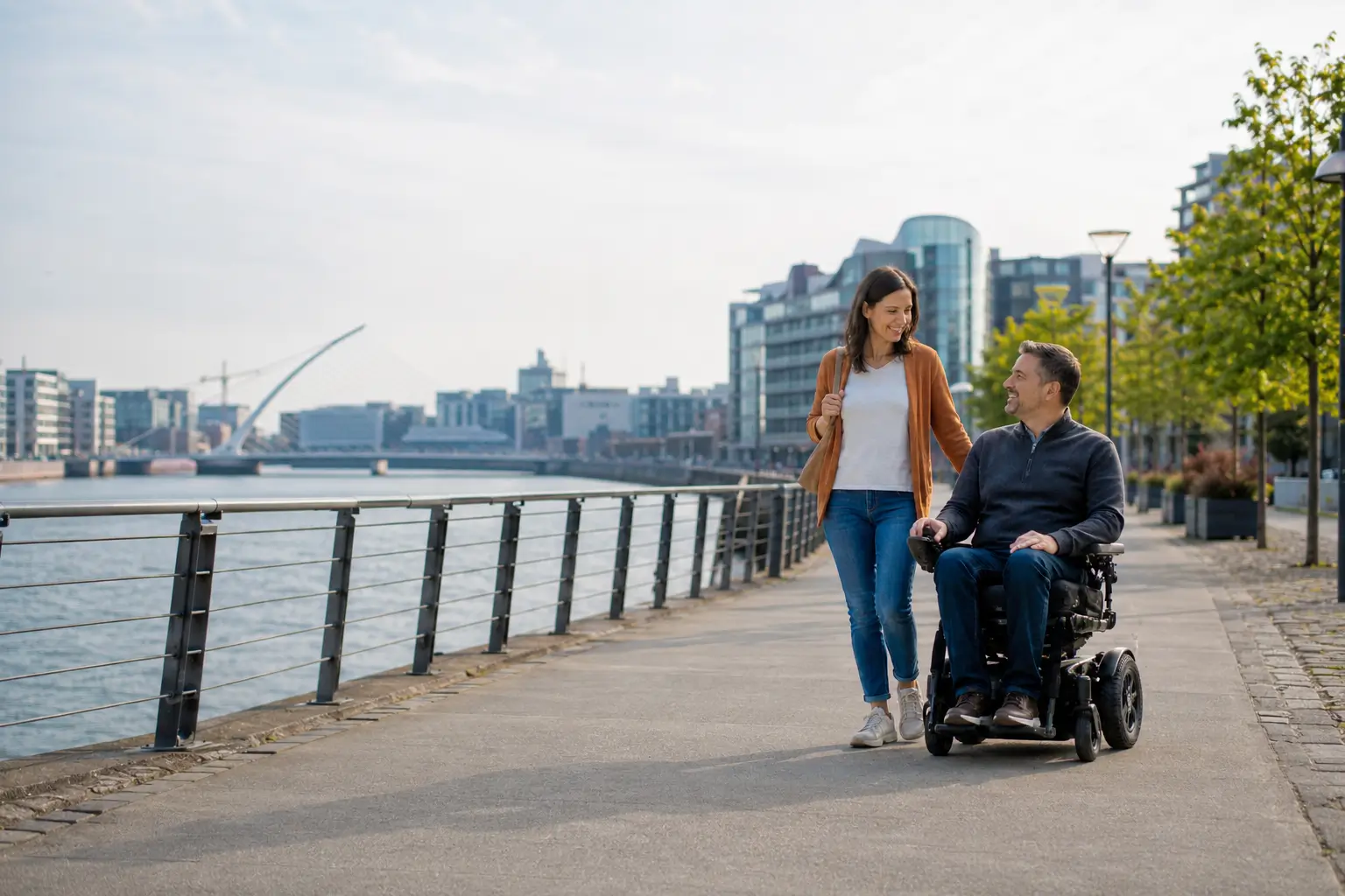 Person using a wheelchair along the River Liffey in Dublin. BES Healthcare Ireland supports independence and mobility.